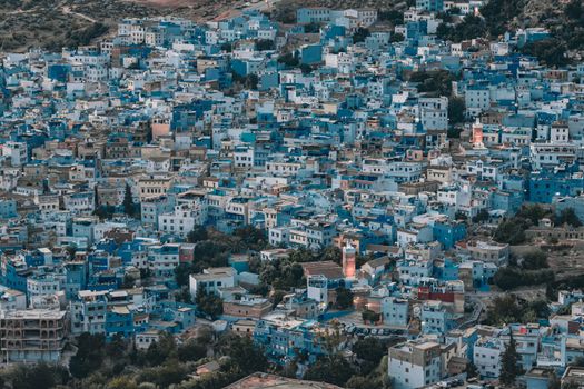 A vibrant aerial shot capturing the iconic blue buildings of Chefchaouen in Morocco.