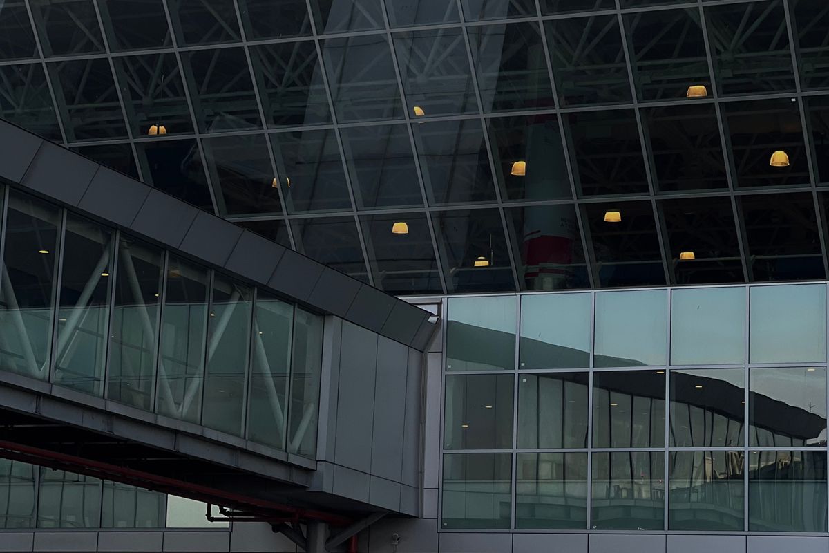 Glass walkway at an airport terminal