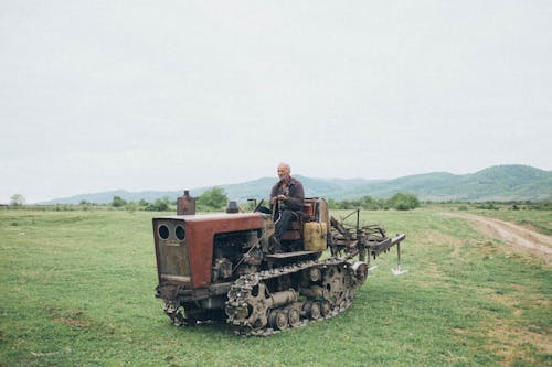 Man Riding Farm Equipment