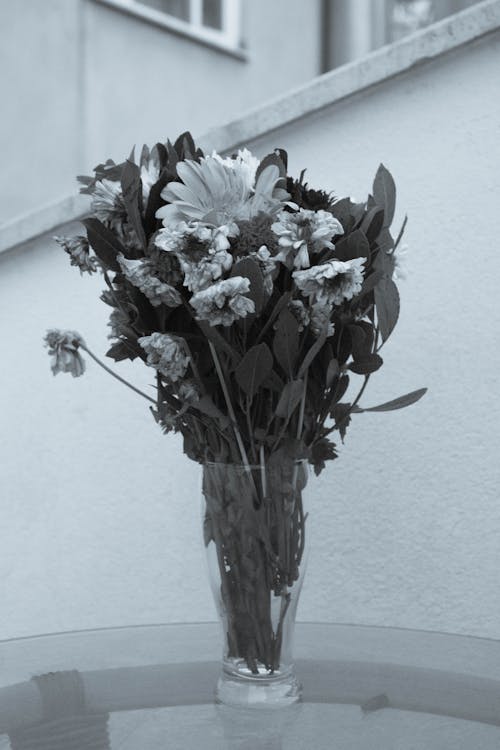 Withering Flowers in a Glass Vase