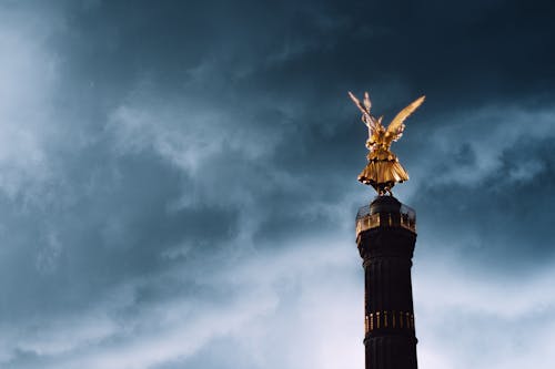 Statue on Column and Clouds