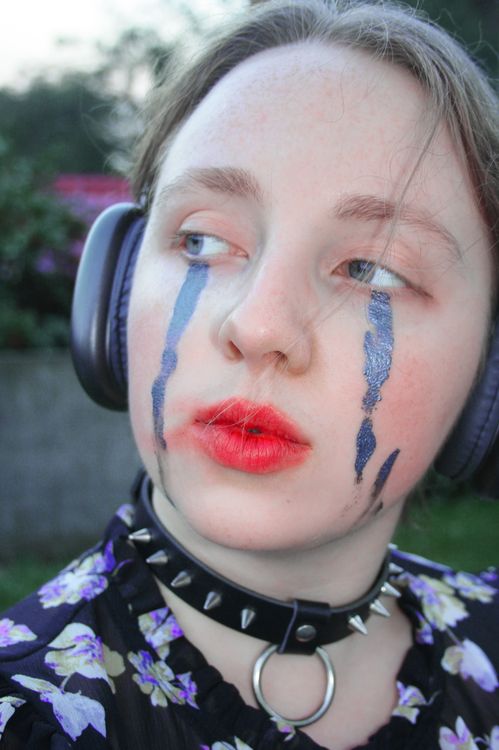 Chocker Paint Young Woman with a Face Paint Wearing a Black Leather Choker · Free ...