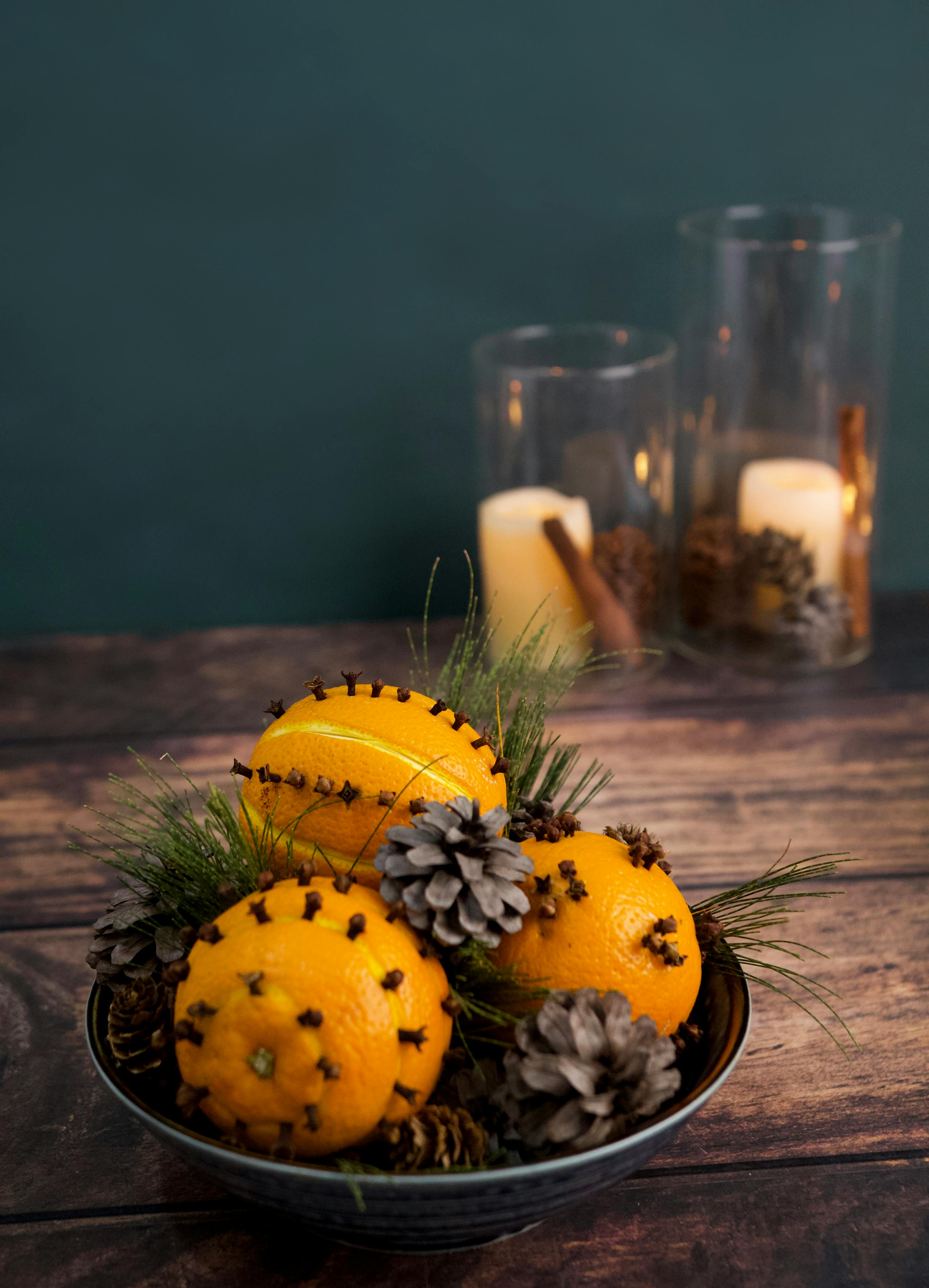 Decorative Bowl with Oranges, Cloves and Pine Cones · Free Stock Photo