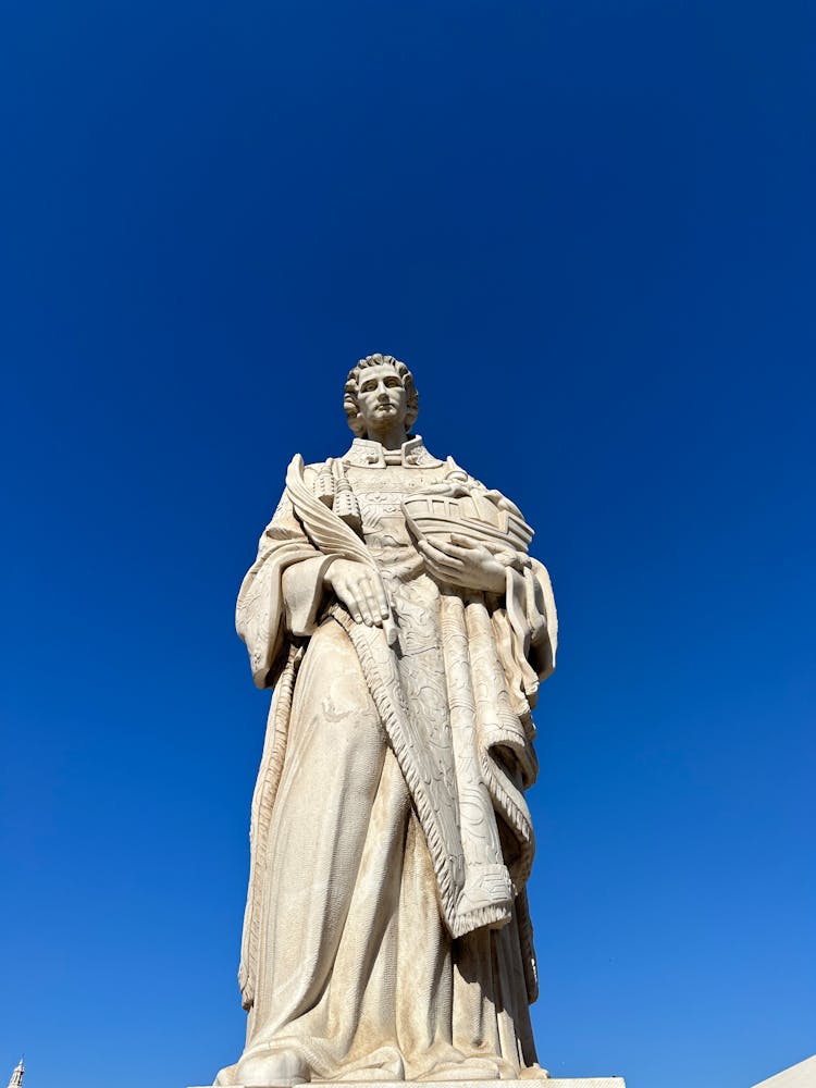 Statue Of St. Vincent Standing Against A Clear Blue Sky