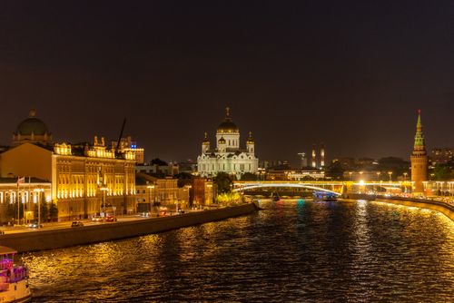 Free Nighttime view of the Moscow River, Kremlin, and Cathedral in Russia, beautifully illuminated. Stock Photo
