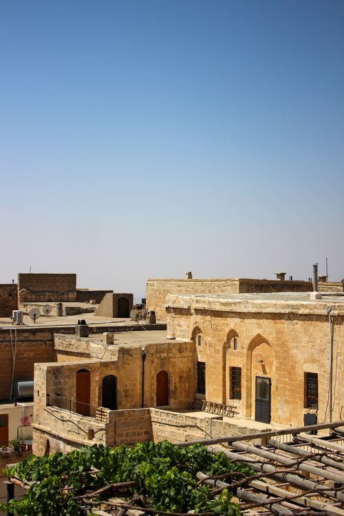 Free Stone buildings showcasing ancient architecture under a clear blue sky — perfect for concepts of history and culture. Stock Photo