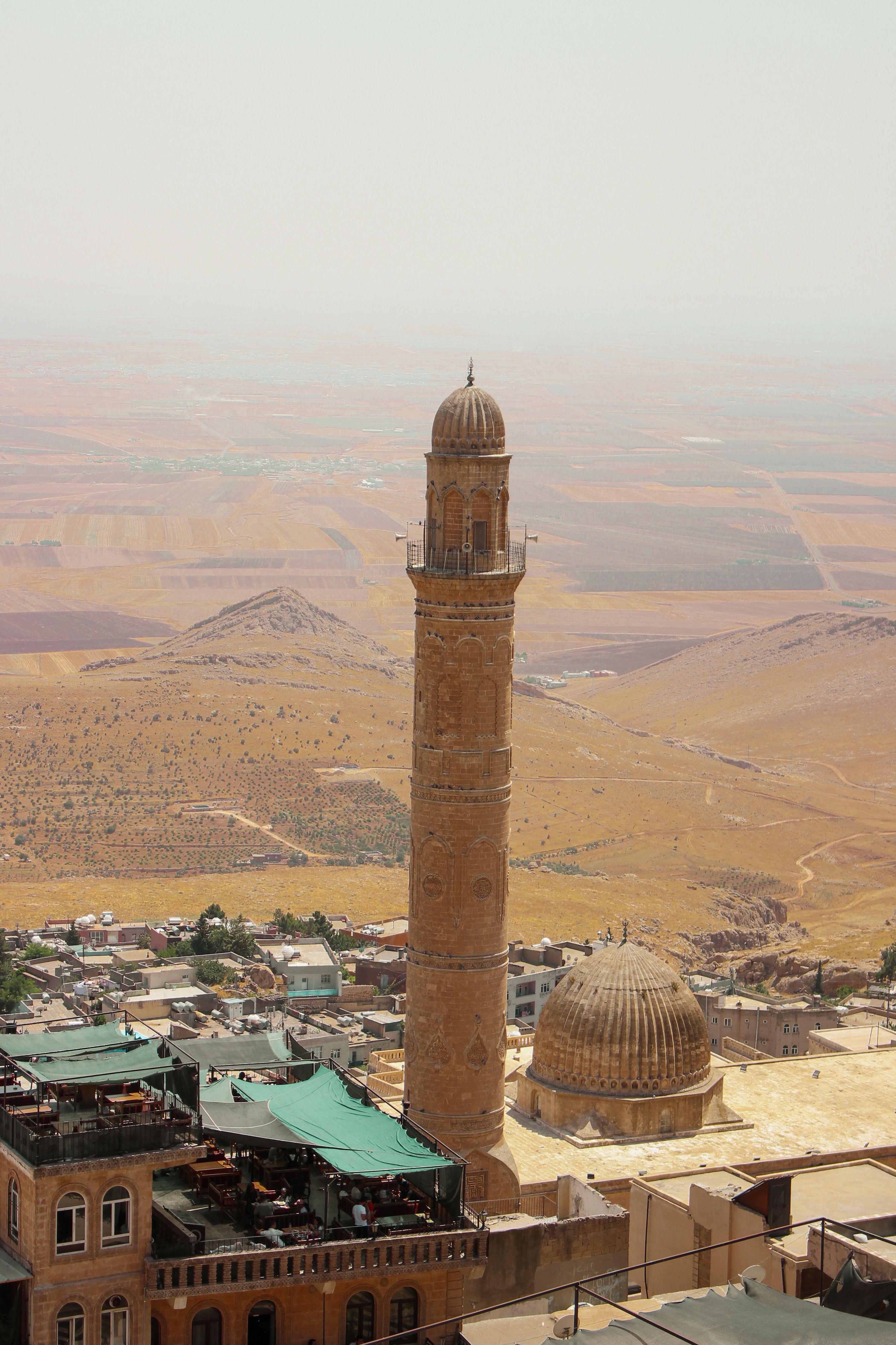 Aerial view of Ulu Camii Minaret in Mardin, Turkey showcasing the historical architecture.