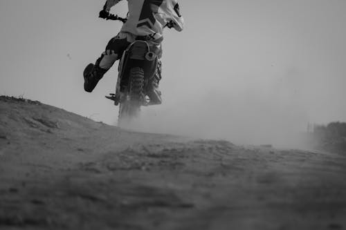 Rider on Motocross Among Dust