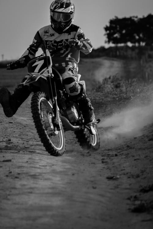 Man Riding Motocross on Mud