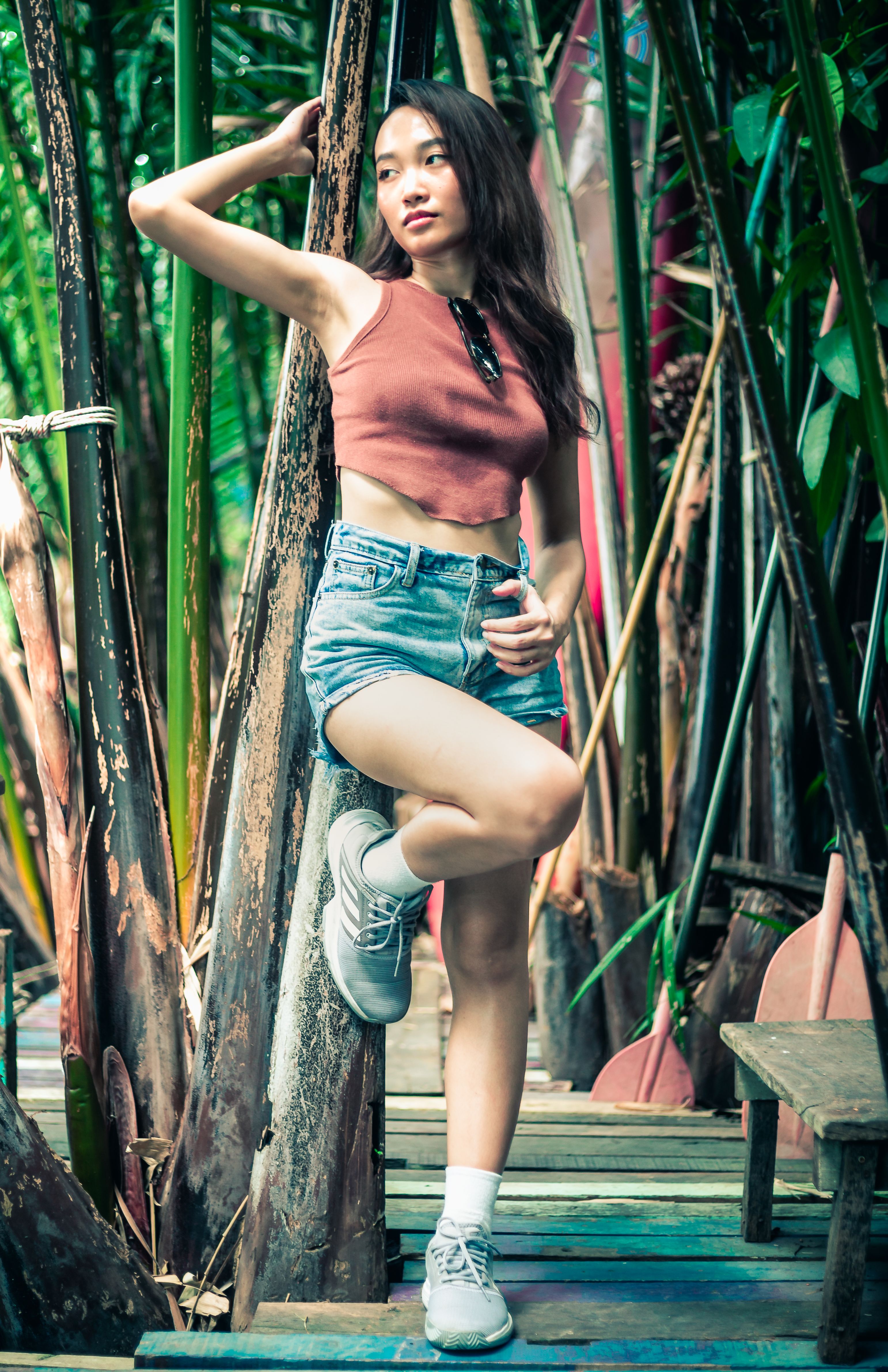 Brunette Woman in Red Top and Denim Shorts · Free Stock Photo