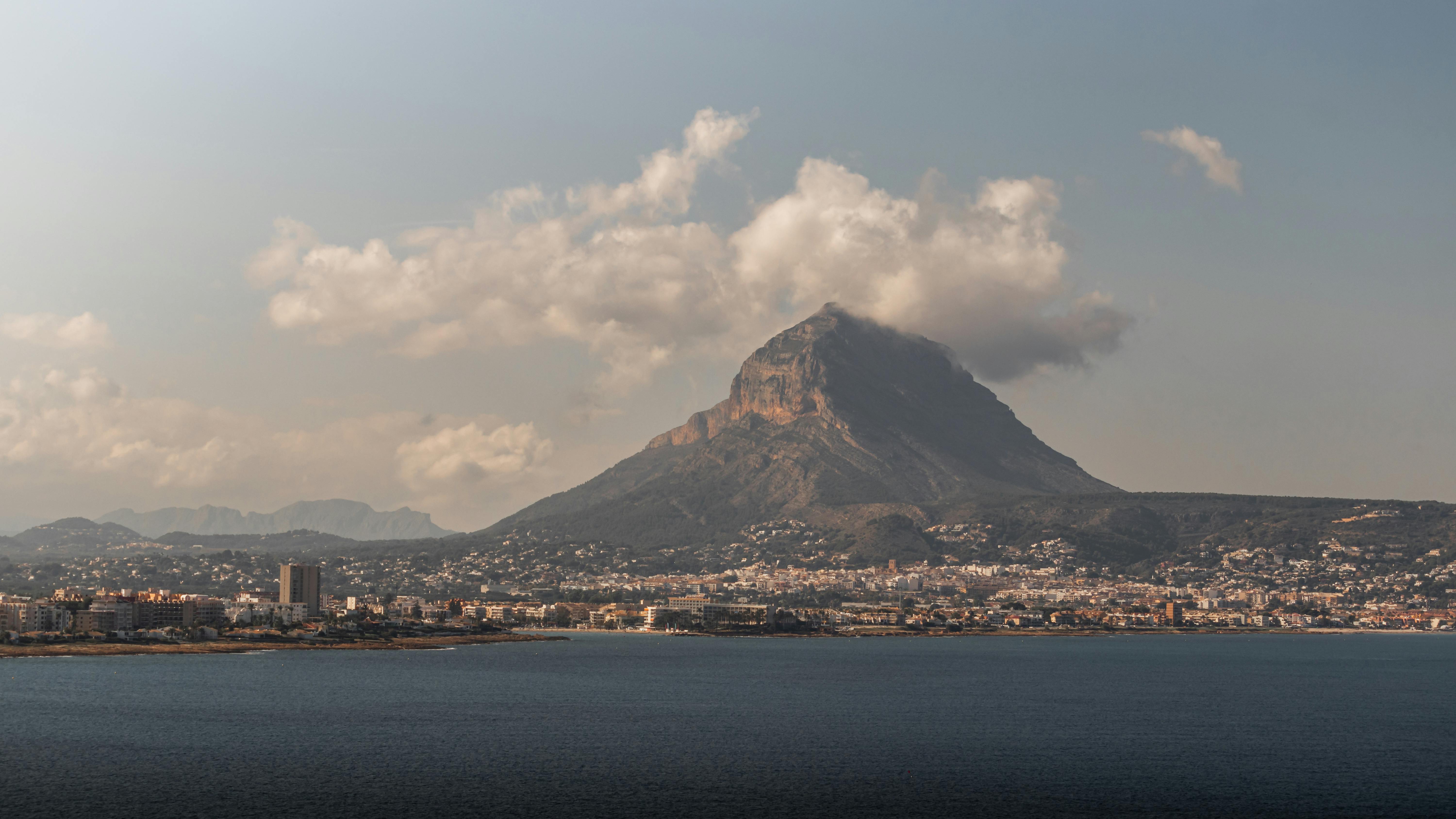 Scenic aerial view of Montgo Mountain and the coastal city of Javea, Spain
