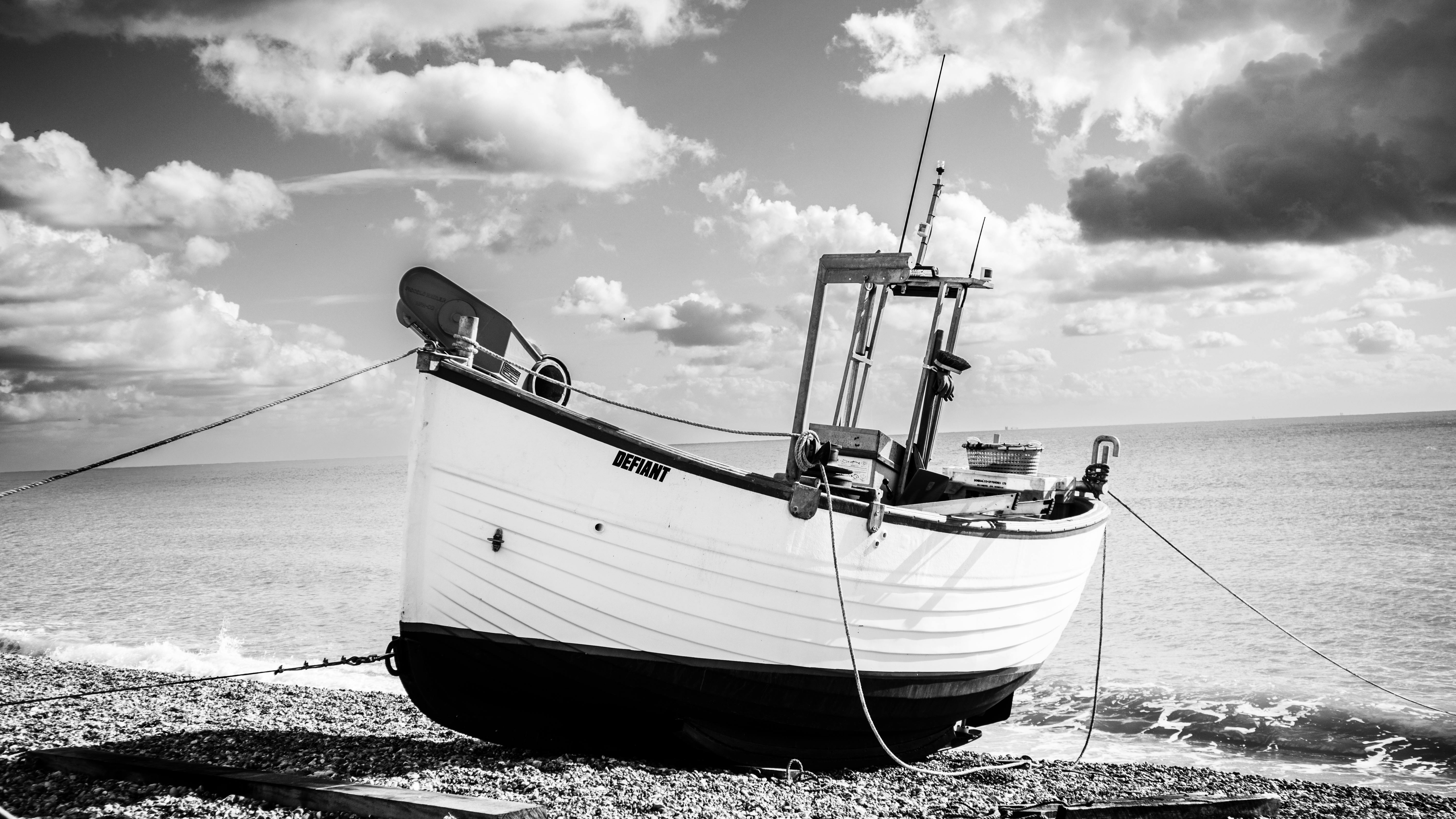 Fishing Boat on Beach in Black and White · Free Stock Photo