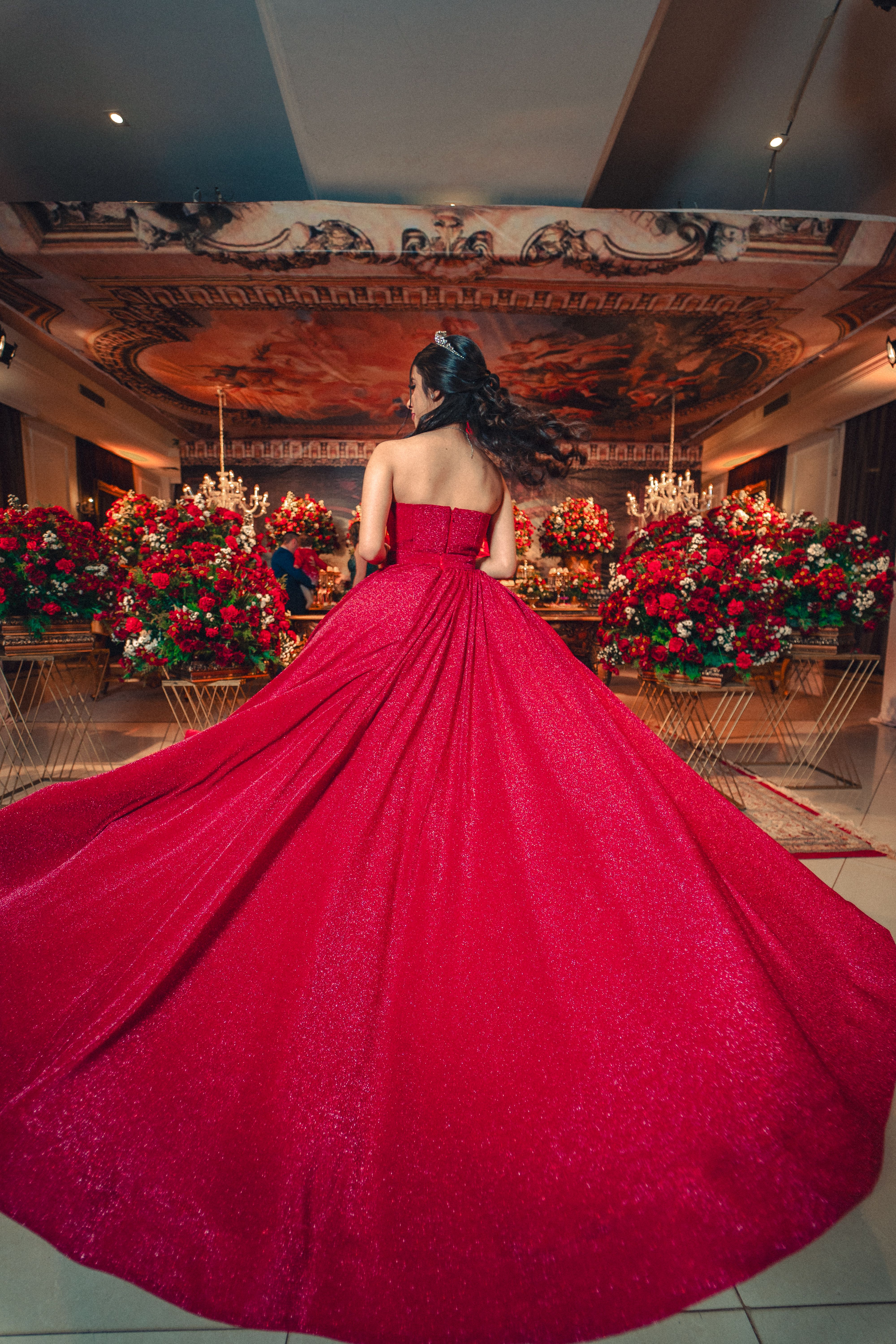 A Teenage Girl in a Red Dress Posing at her Birthday Party  Free Stock  Photo