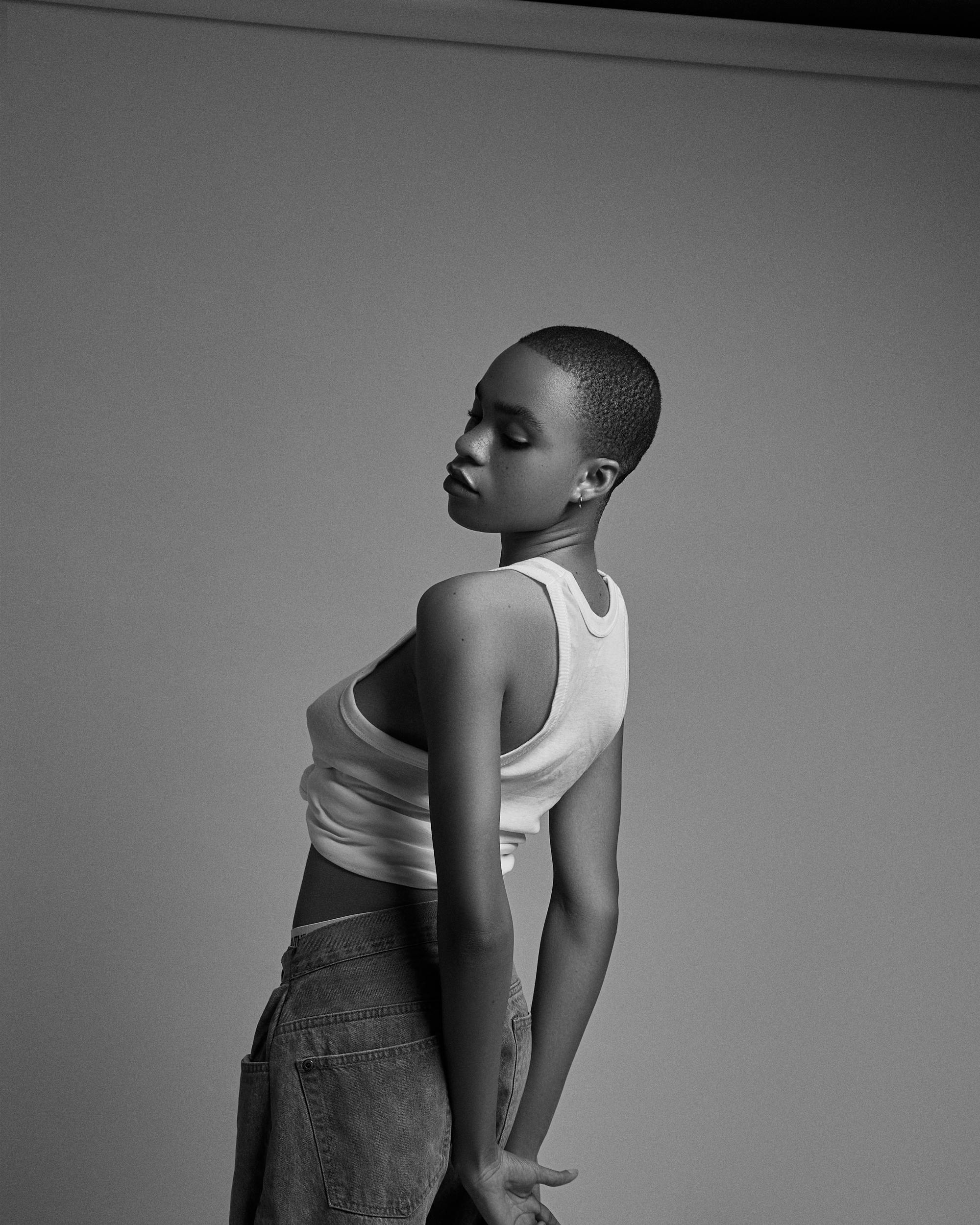 Elegant black and white portrait of a female fashion model with short hair.