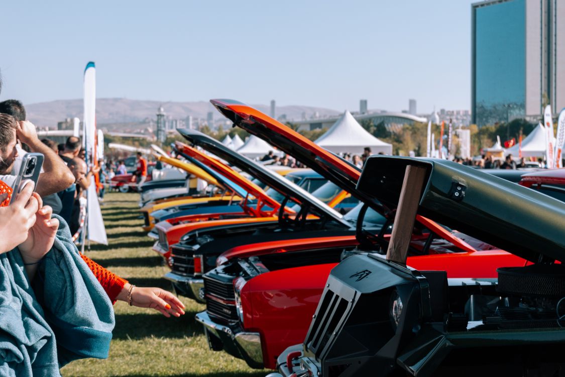 Car Show Riser Row of Classic American Cars with Raised Hoods at the Car Show · Free ...