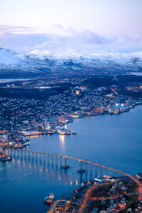 View Of The Tromsdalen Area With The Tromso Bridge In The City Of view-of-the-tromsdalen-area-with-the-tromso-bridge-in-the-city-of