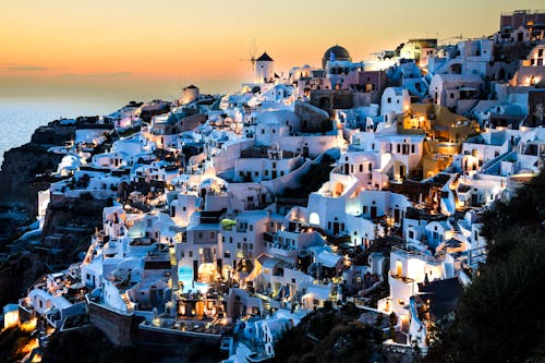 Seaside Village of Oia on a Mountainside at Dusk