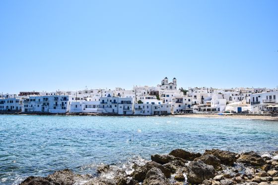 Colourful houses along a Mediterranean bay — photo by AXP Photography on Pexels