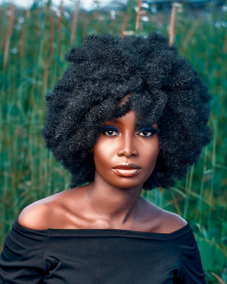 Portrait Of A Beautiful Woman With Afro Hair Posing Outside