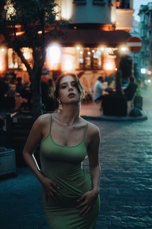 Model Posing in Pencil Dress in City in the Evening 