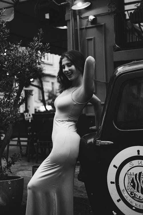 Cheerful Model Posing in Long Dress