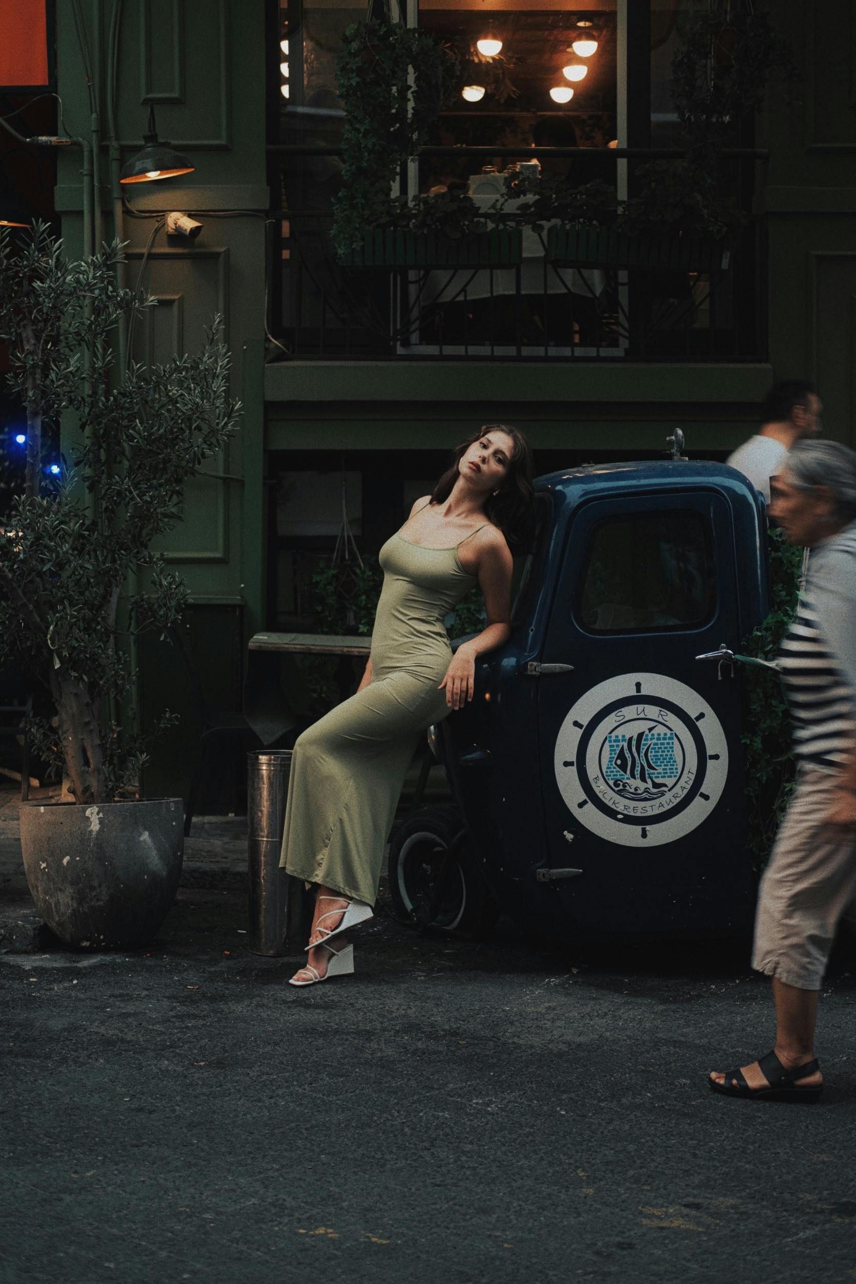 Model Posing in Green Dress by Car · Free Stock Photo