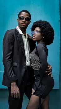 Elegant portrait of a fashionable couple embracing, capturing modern style in Ikoyi, Lagos.