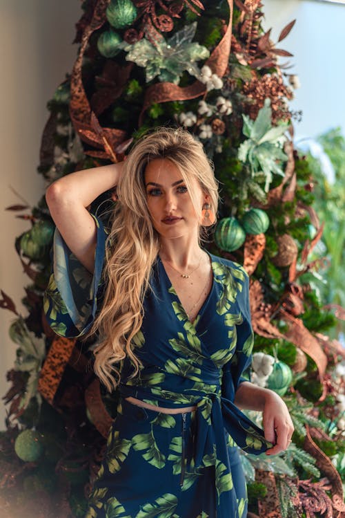 Woman In Blue And Green Floral Dress