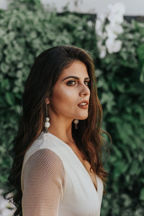 Side View Photo of Woman in White Outfit