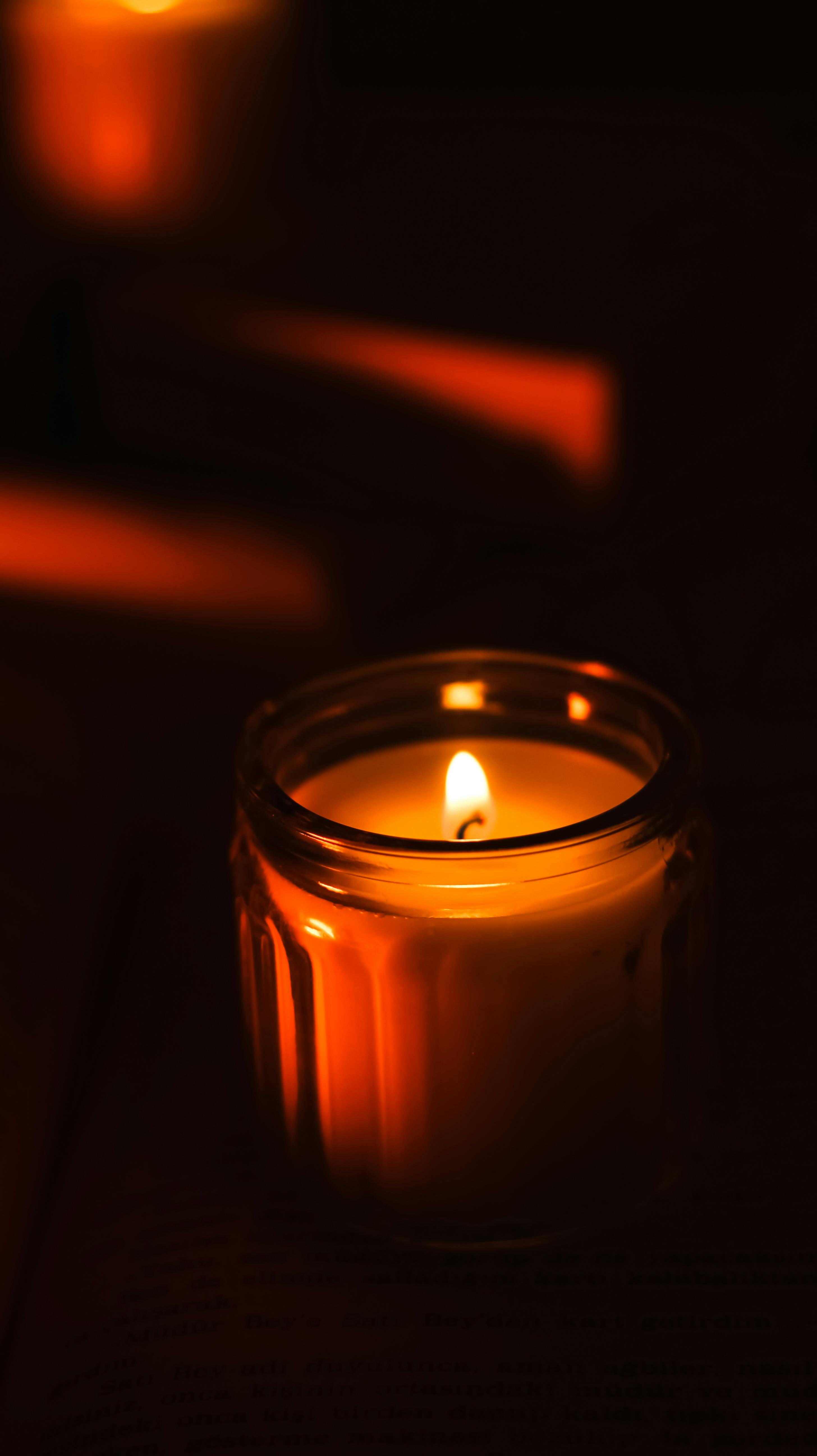 Burning Wax Candle in Darkness · Free Stock Photo