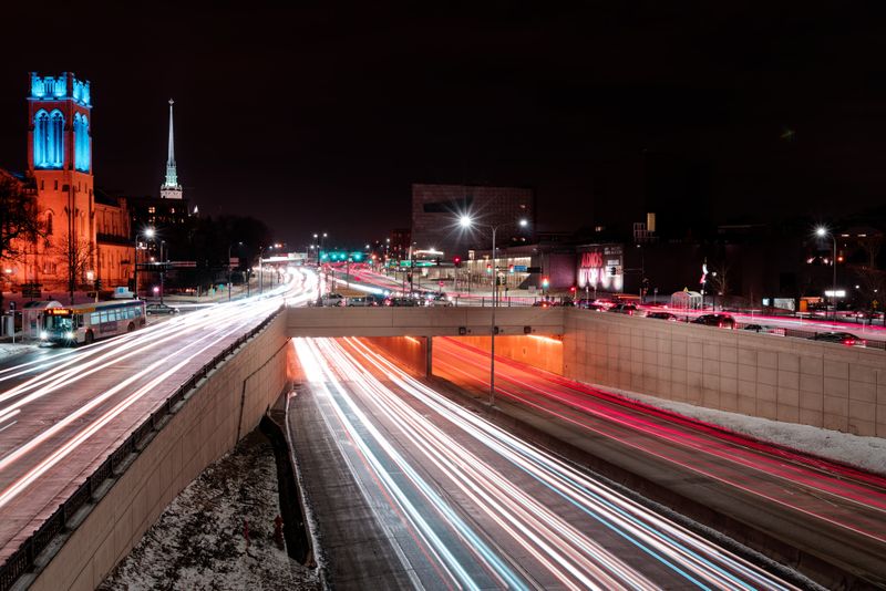 Illuminated downtown Minneapolis streets at night in a long exposure