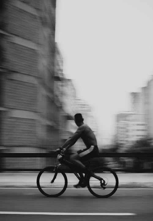 Free Man on a Bicycle on the Street  Stock Photo