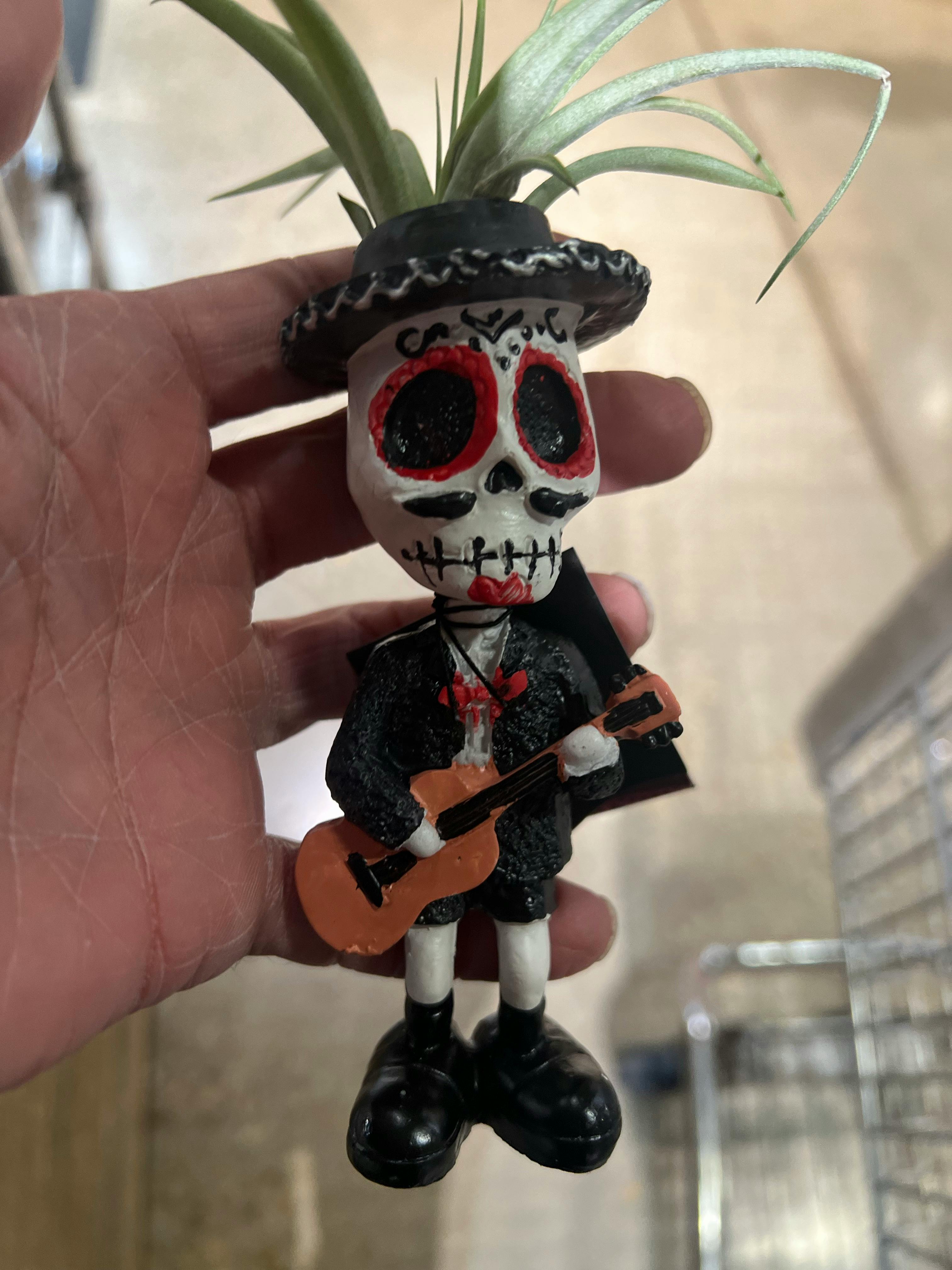 Spotlights shining over a stadium entrance at night