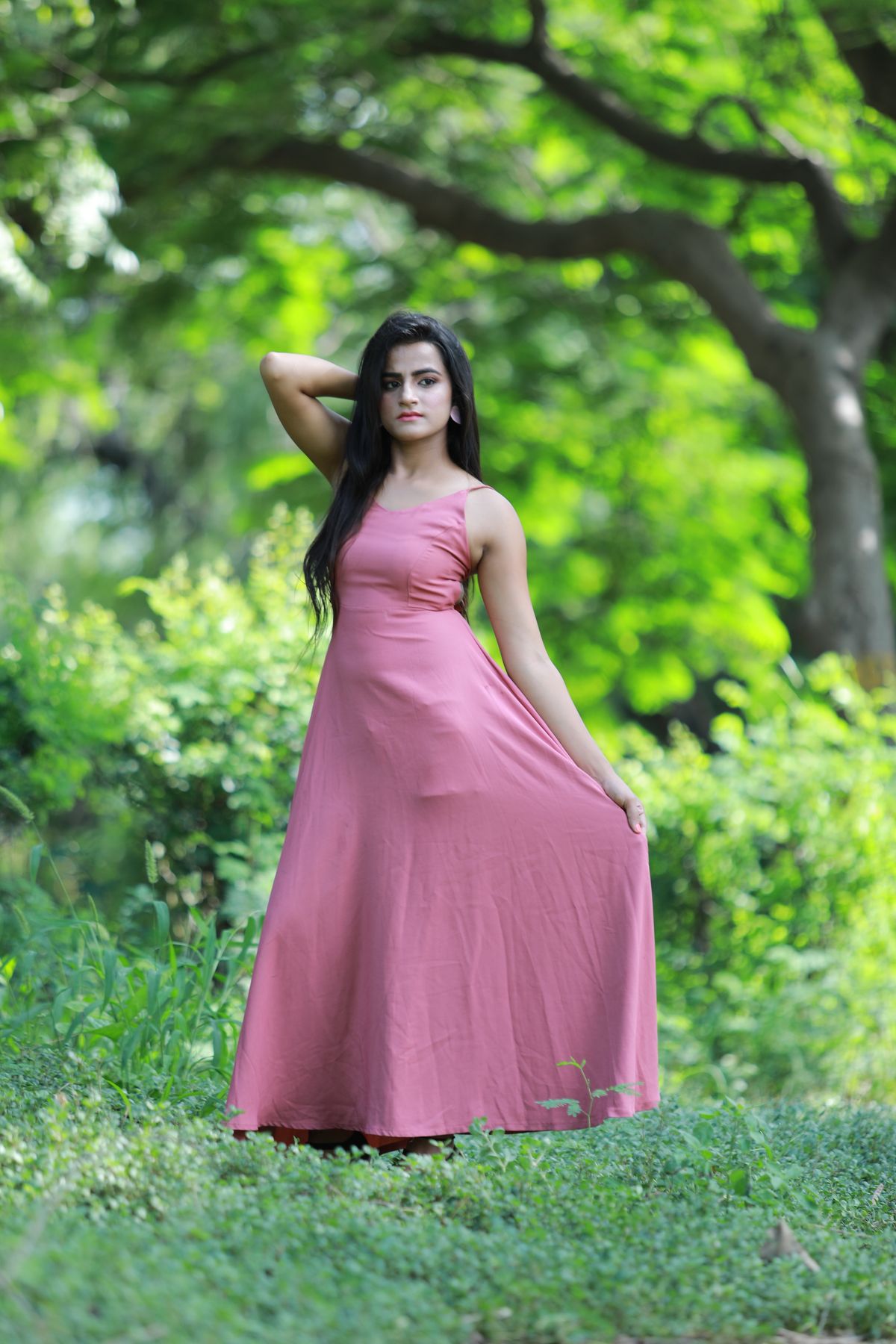 Woman wearing an off-the-shoulder summer maxi dress on a warm evening