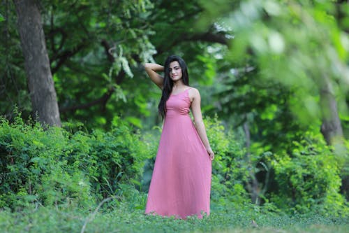 Woman in Pink Dress in Forest