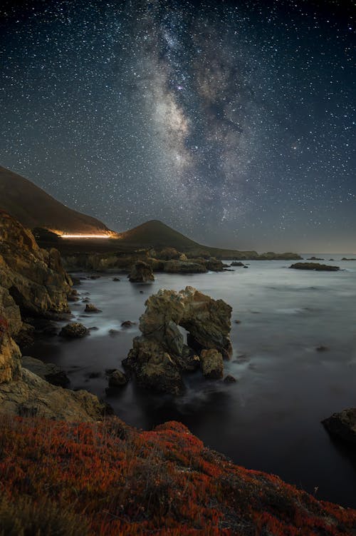 The milky way over the ocean at night