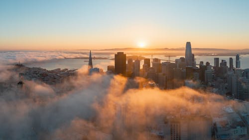 The sun rises over the city of san francisco