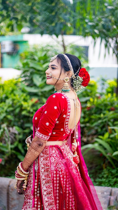 Bride Posing in Traditional Red Saree and Jewelry