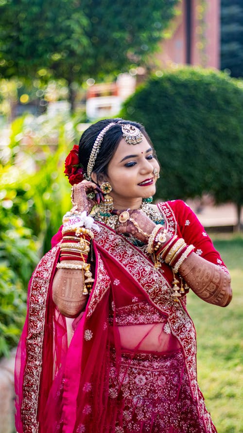 Woman Posing in Red Wedding Saree