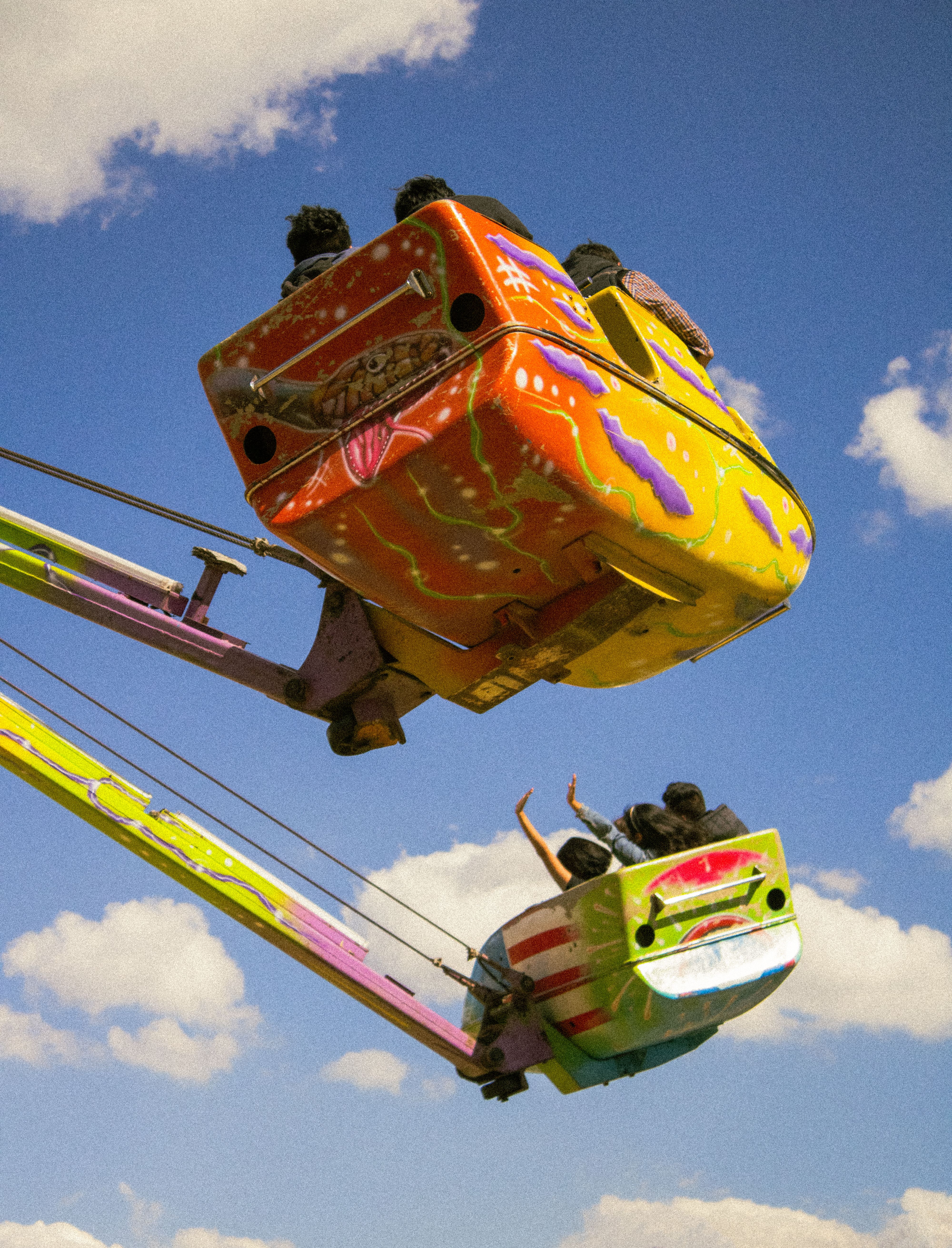 Snake Shot Ride A Man and Woman Riding on the Sling Shot · Free Stock Photo