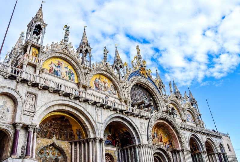 Mosaic-covered facade of St Mark's Basilica in Venice