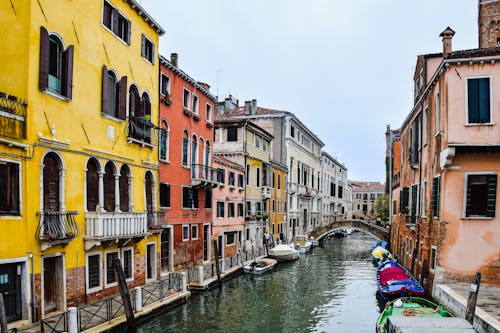 View of Colorful Houses and Gondolas on the Side of the Canal in Venice, Italy 