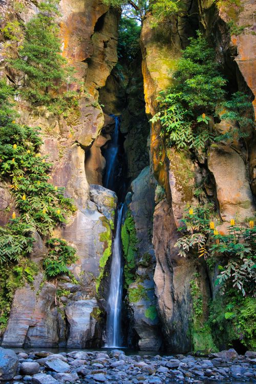 Free Captivating view of Salto do Cabrito waterfall cascading down rocky cliffs with lush greenery. Stock Photo