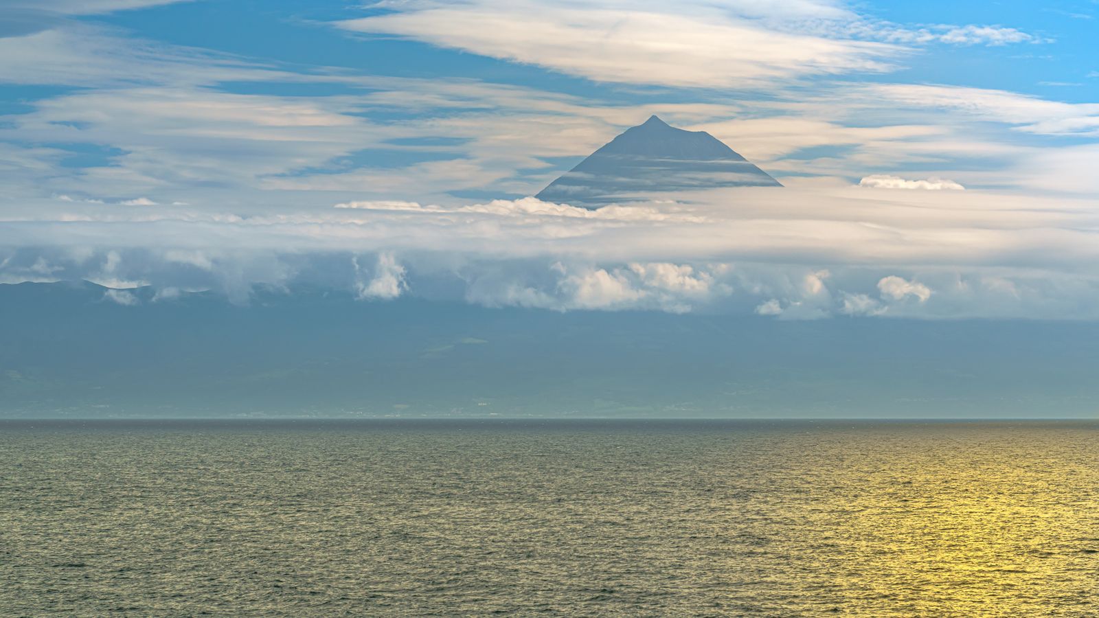 Sea and a distant mountain covered by clouds, Sao Tome and Principe
