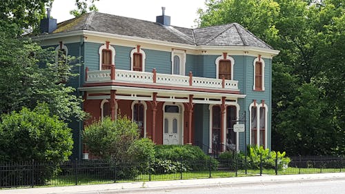 Free Landscape Photography of Gray and Brown 2 Storey House Stock Photo