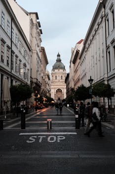 Historic Budapest street view with St. Stephen's Basilica at sunset