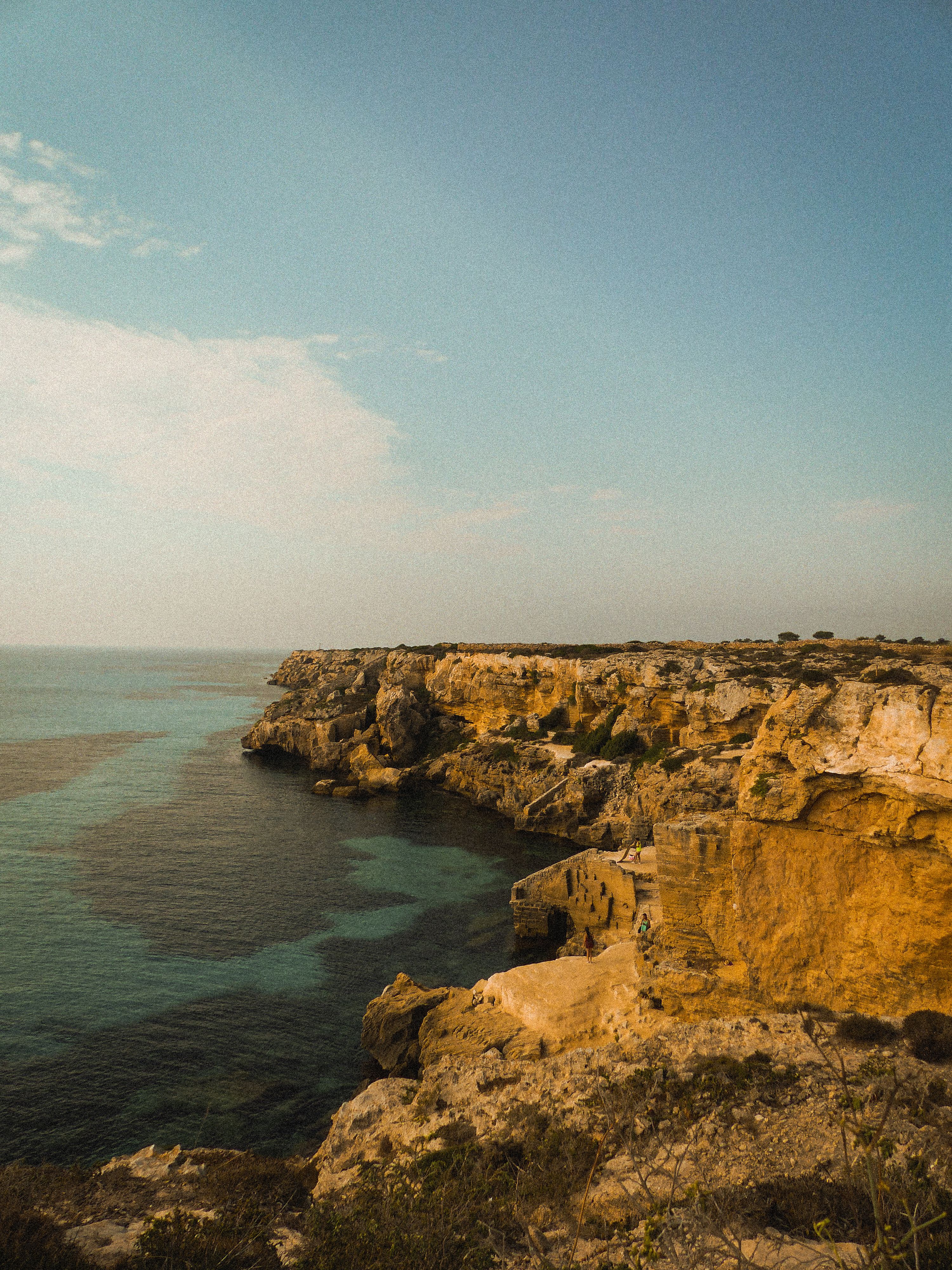 Cliff Rocks on Sea Shore · Free Stock Photo