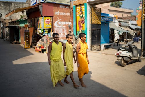 Indian Boys in Traditional Clothing Walking down the Street 