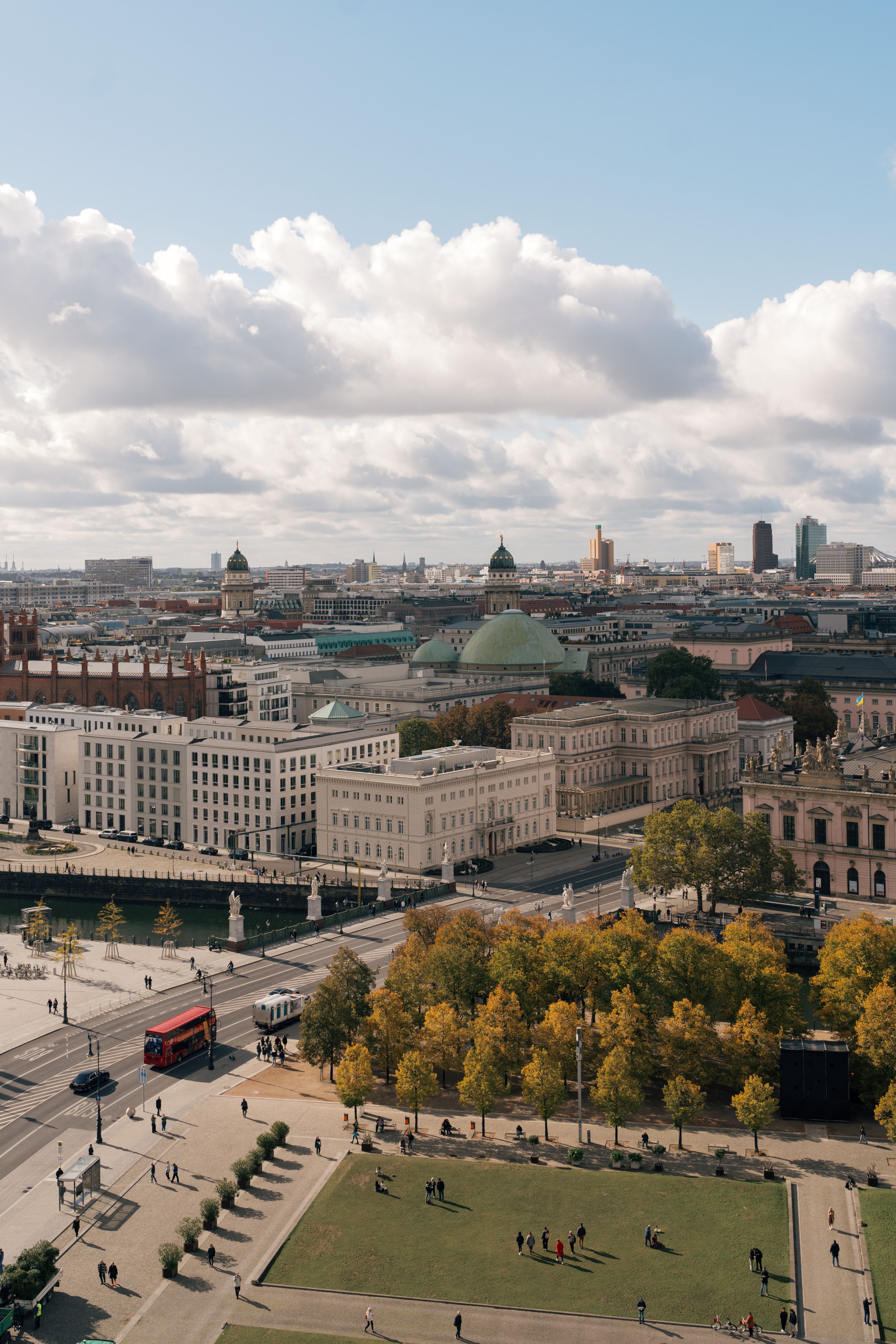 Free Aerial view of Berlin cityscape featuring historical landmarks under a cloudy sky. Stock Photo