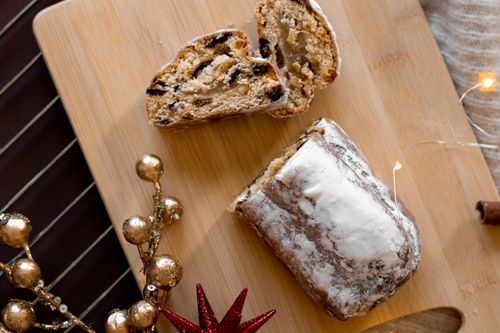 Free A delicious sliced stollen bread with dried fruits, perfect for festive occasions. Stock Photo